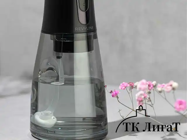 Ирригатор для полости рта REVYLINE RL 450 New, портативный, емкость резервуара 0,3 л, 5 насадок, черный, 7993